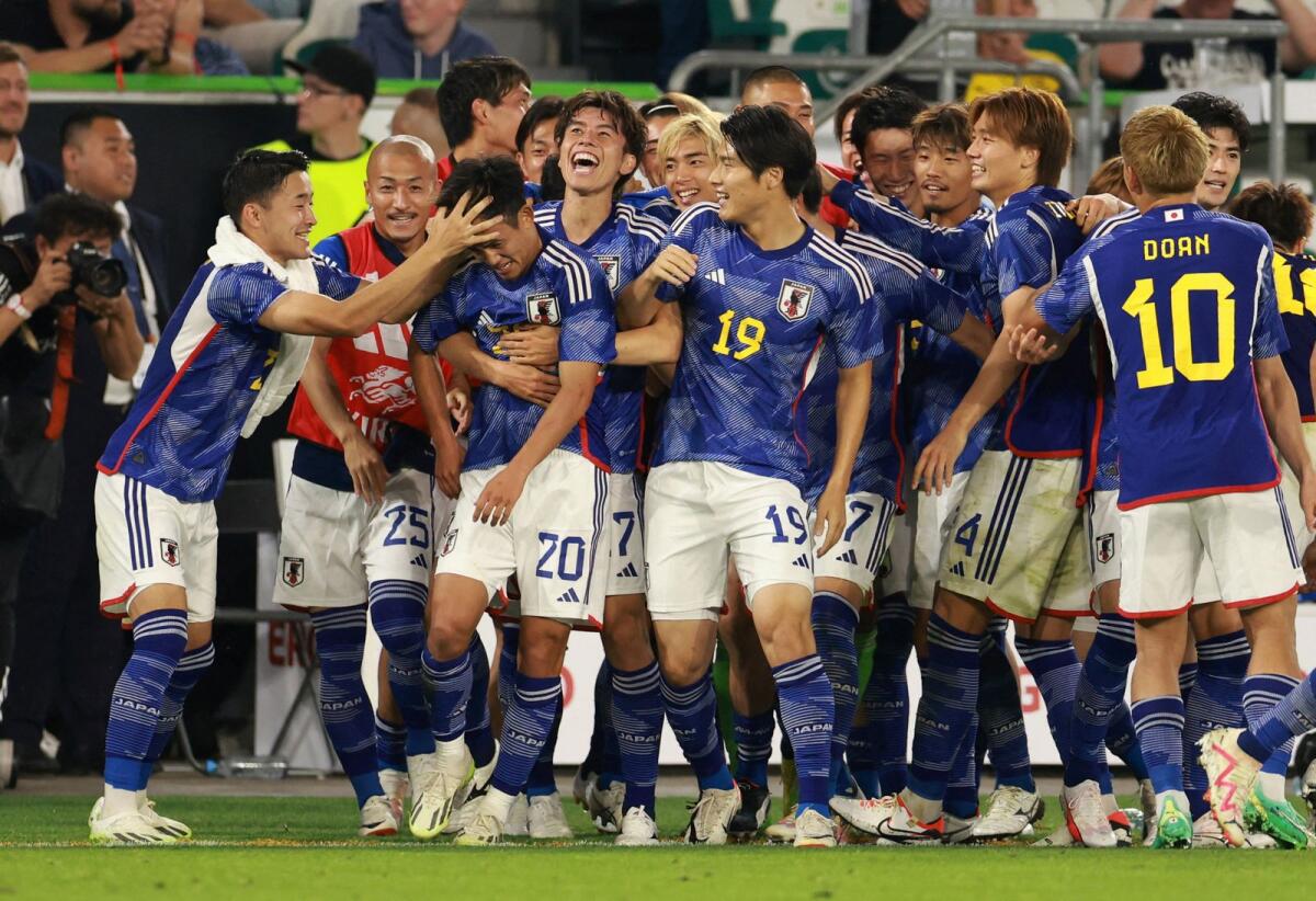 خوشحالی بازیکنان ژاپن پس از پیروزی برابر آلمان